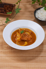 Chicken curry in a bowl / Vietnam chicken curry on wooden background
