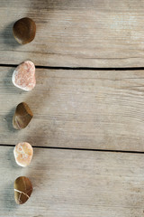 Wooden background. Marine theme.  Pebble Stones. Place for text.