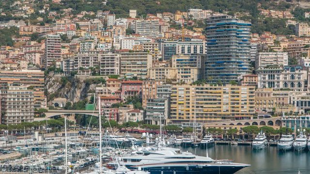 Monte Carlo city aerial panorama timelapse. View of luxury yachts and apartments in harbor of Monaco, Cote d'Azur.