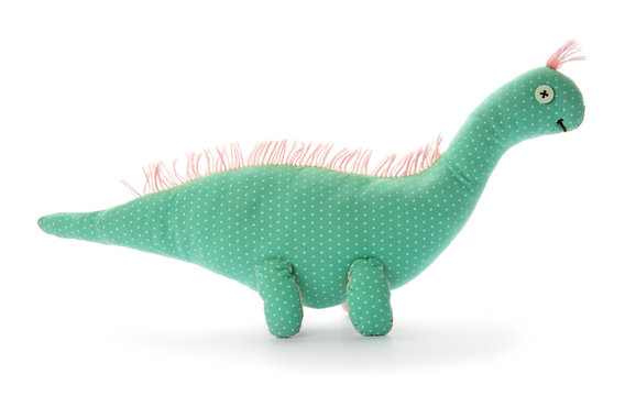 Cute Toy Dinosaur On White Background