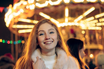 Obraz premium red-haired girl in christmas, outdoor