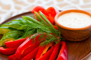 Appetizer of sliced vegetables and sauce