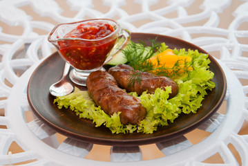 sausage grilled with herbs and sauce