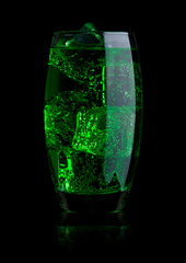 Glass of green energy carbonated soda with ice