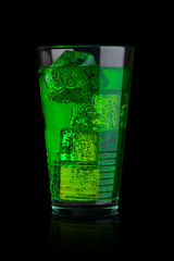 Glass of green energy carbonated soda with ice