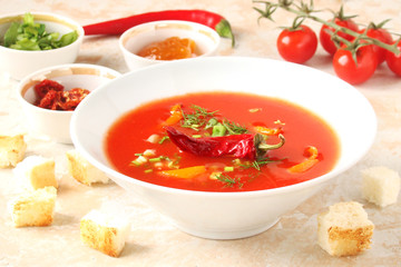 tomato soup with chilli peppers, sweet peppers, garlic, herbs and spices with toast