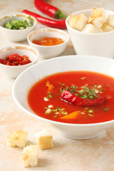 tomato soup with chilli peppers, sweet peppers, garlic, herbs and spices with toast