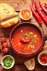 tomato soup with chilli peppers, sweet peppers, garlic, herbs and spices with toast