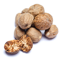 heap of nutmegs isolated on white background
