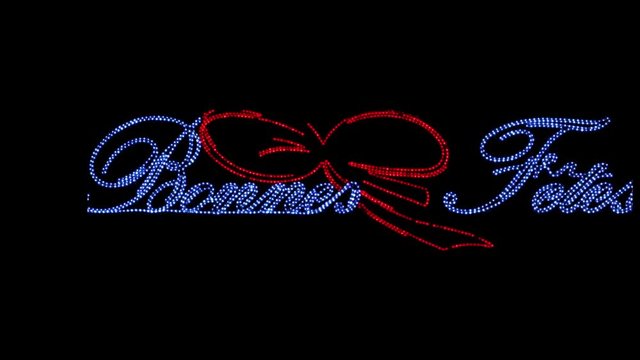 Travelling d'une enseigne lumineuse indiquant bonnes f&ecirc;tes