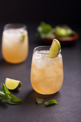 Fresh cocktail prepared with ginger beer, lime, mint and ice
