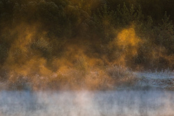 Image of morning mist over the surface of water 