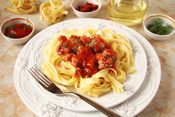 Fettuccine pasta balls with Bolognese sauce