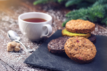 Homemade Christmas or New Year holiday oatmeal cookies with pistachios and chocolate. Concept of festive desserts