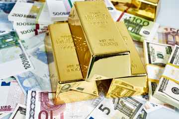 Investment in gold.Money and Gold. gold bullions. Financial concept