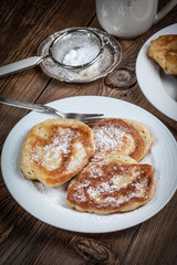 Polish pancakes with powdered sugar.