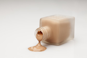 a glass bottle and a liquid base that is drawn from it