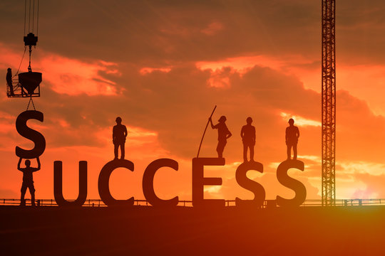 Silhouette of the success of the construction worker, the concept of success of the work is tired than to accomplish it, which has been difficult.
