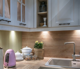 Kitchen utensils on a wooden table top in a beautiful modern kitchen