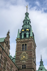 Naklejka premium Frederiksborg Castle (Frederiksborg Slot, XVII century) - palace in Hillerod, Denmark. It was built as royal residence for King Christian IV of Denmark-Norway, now History Museum. Belfry tower.