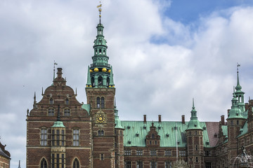 Naklejka premium Frederiksborg Castle (Frederiksborg Slot, XVII century) - palace in Hillerod, Denmark. It was built as royal residence for King Christian IV of Denmark-Norway, now History Museum. Belfry tower.