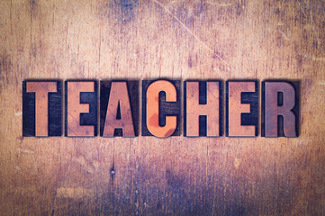Teacher Theme Letterpress Word on Wood Background