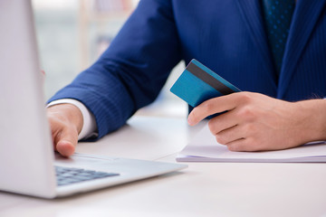 Man paying with credit card online