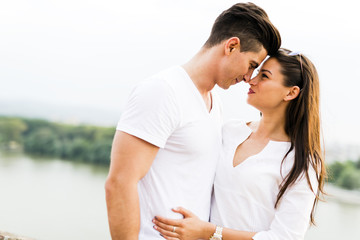 Young beautiful couple rubbing noses as a sign of love