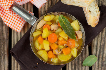 Chicken stew with potatoes and pumpkin in gravy