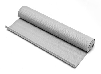 A grey rolled up fitness mat on white background.