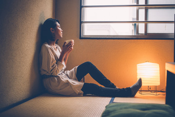 Beautiful japanese woman, lifestyle moments in a traditional apartment