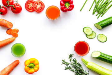 Wellness elements. Colorful detox drinks with vegetables  on white background top view copyspace