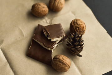 Natural chocolate and nuts on vintage paper Organic sweets Natural food concept