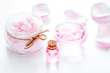 rose organic cosmetics with salt, cream and oil on white table b