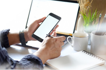 Man using mobile phone in office.