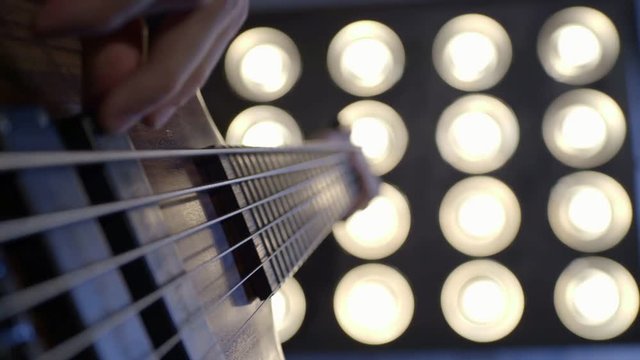 Close-up of hands of a bass guitar player. Find similar clips in our portfolio.