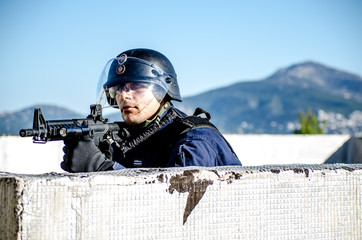 Police special forces, blue uniform protection helmet blue sky