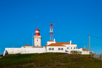 Fototapeta na wymiar Lighthouse at Cabo da Roca (Cape Roca) - cape which forms the westernmost extent of mainland Portugal
