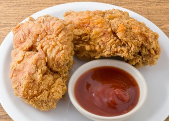 Deep Fried Chicken with Sauce on A White Dish