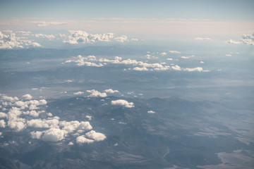 Fototapeta na wymiar aerial shot from plane flying above the desert in daytime