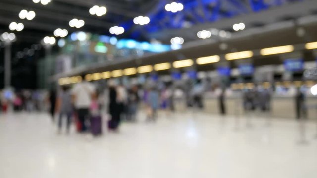 Abstract Background : Blurred image of tourist walking in front of check-in counter at an airport.