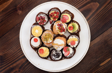 Assortment of sweet desserts with ricotta cream and cream