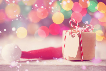 Christmas present or box with Santa hat. Greeting card. Toning image