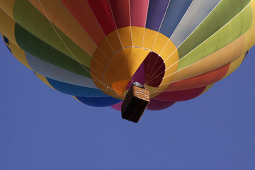 Obraz premium Hot air Balloon. Floating free in the sun light on a blue sky