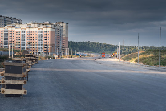 New Asphalt Road And Appartment Buildings In Suburban Area