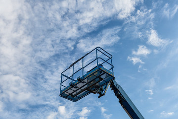 The basket crane and cloudy sky