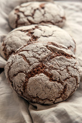 A beautiful loaf of rye farm sourdough bread is handmade. Close-up.