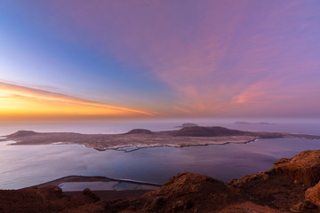 Sunset in La Graciosa. Canary islands. Beautiful wiew of the island with a color sky.