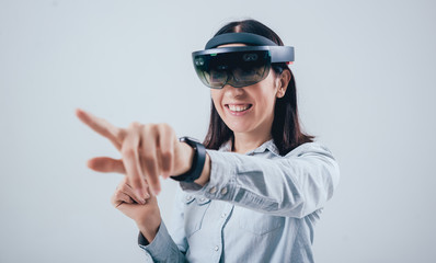 Woman wearing augmented reality goggles.
