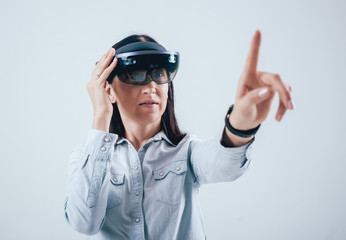 Woman wearing augmented reality goggles.